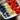 Colorful yogurt fruit bowl topped with fresh berries and granola.