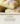 Delicious 2 Ingredient Lemon Cake Bars cut into squares on a white plate