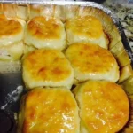 Freshly baked 7-Up Biscuits rising with soda for a light and fluffy texture.