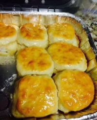 Freshly baked 7-Up Biscuits rising with soda for a light and fluffy texture.
