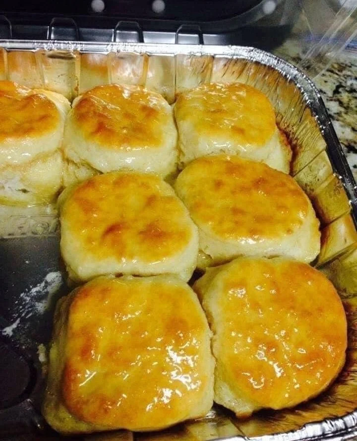 Freshly baked 7-Up Biscuits rising with soda for a light and fluffy texture.