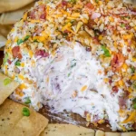 Delicious Bacon Ranch Cheese Ball served on a platter with crackers
