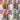 Assorted bakery style cupcakes with colorful frosting and decorations