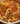 Bowl of delicious goulash with noodles and beef, garnished with parsley