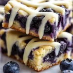 Delicious blueberry lemon cookie bars topped with white chocolate drizzle