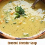 Bowl of creamy Broccoli Cheddar Soup garnished with fresh herbs