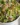 Colorful broccoli salad with nuts and dressing in a bowl