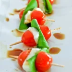Delicious Caprese Skewers with cherry tomatoes, mozzarella, and fresh basil