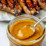 Bottle of Carolina Gold BBQ Sauce with a delicious golden color and rich flavor.