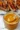 Bottle of Carolina Gold BBQ Sauce with a delicious golden color and rich flavor.