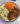Delicious chicken wings served with potato salad, broccoli, and cauliflower