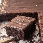 Delicious homemade Chocolate Sheet Cake garnished with chocolate frosting.