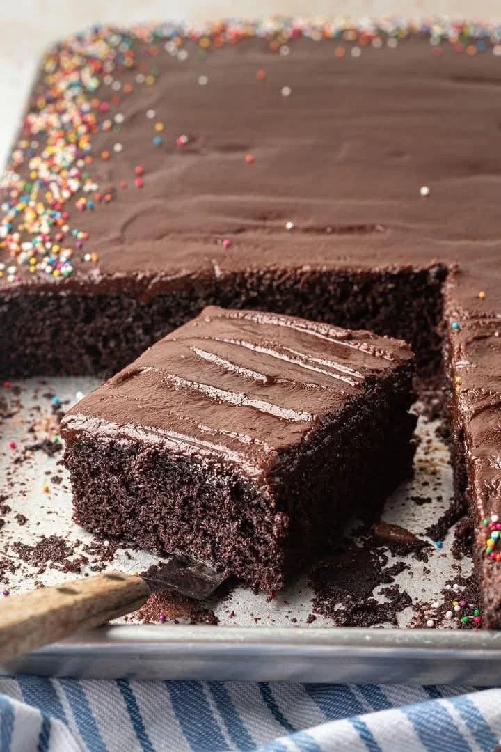 Delicious homemade Chocolate Sheet Cake garnished with chocolate frosting.