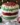 A festive Christmas Trifle dessert with layers of cream, fruits, and sponge cake