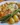 Creamy garlic butter chicken dish with roasted potatoes and asparagus on a plate.
