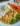 Creamy mustard chicken dish with rice and vegetables on a plate
