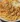 Creamy Parmesan chicken served with penne pasta on a plate