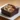 Delicious dark chocolate brownie with nuts on a plate