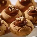 A plate of delectable chocolate nut cookies with rich chocolate and crunchy nuts.
