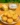 Baked eggless butter cookies on a cooling rack, golden and delicious.