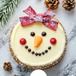 A delicious and decorative snowman cheesecake for festive celebrations