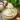 Creamy garlic aioli served in a bowl with fresh garlic cloves