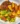 Grilled chicken quarters with crispy wedges and tropical avocado-mango salad