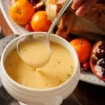 A delicious bowl of homemade turkey gravy ready to serve with Thanksgiving dinner.