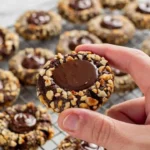Baked chocolate hazelnut cookies on a cooling rack, showcasing their rich texture.
