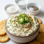 Creamy Jalapeño Cream Cheese Dip served in a bowl with tortilla chips
