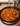 A bowl of delicious lasagna soup topped with fresh basil and cheese.