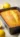 Delicious lemon sponge cake on a white plate garnished with lemon slices