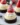 Mini Santa Hat Cheesecakes topped with whipped cream and strawberry decoration