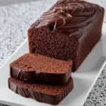 Delicious One Bowl Chocolate Cake topped with chocolate frosting