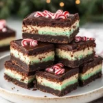 Gluten-free peppermint cheesecake bars topped with crushed peppermint candy