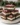 Gluten-free peppermint cheesecake bars topped with crushed peppermint candy