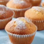 Delicious homemade vanilla cupcakes with cream frosting on a plate
