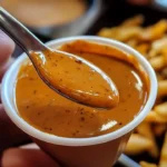 Delicious Cane's Sauce from Raising Cane's served with crispy chicken tenders