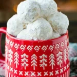 Plate of delicious Russian Tea Cakes dusted with powdered sugar.