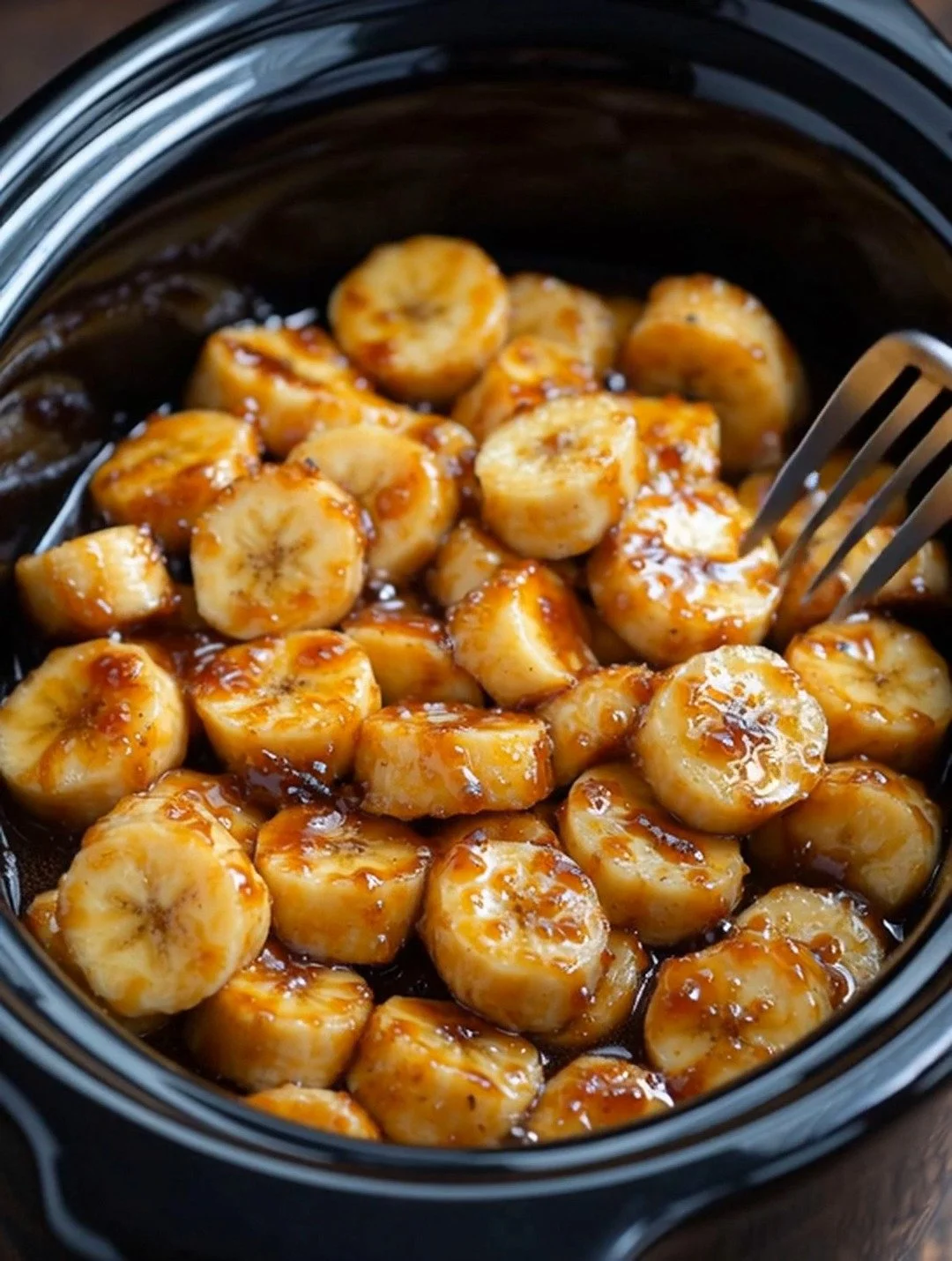 Delicious slow cooker banana foster pudding with five simple ingredients.