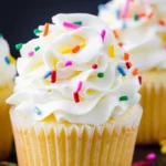 Delicious vanilla cupcake with buttercream frosting and sprinkles