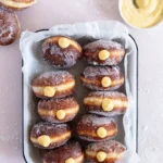 Delicious vanilla custard filled donuts on a plate