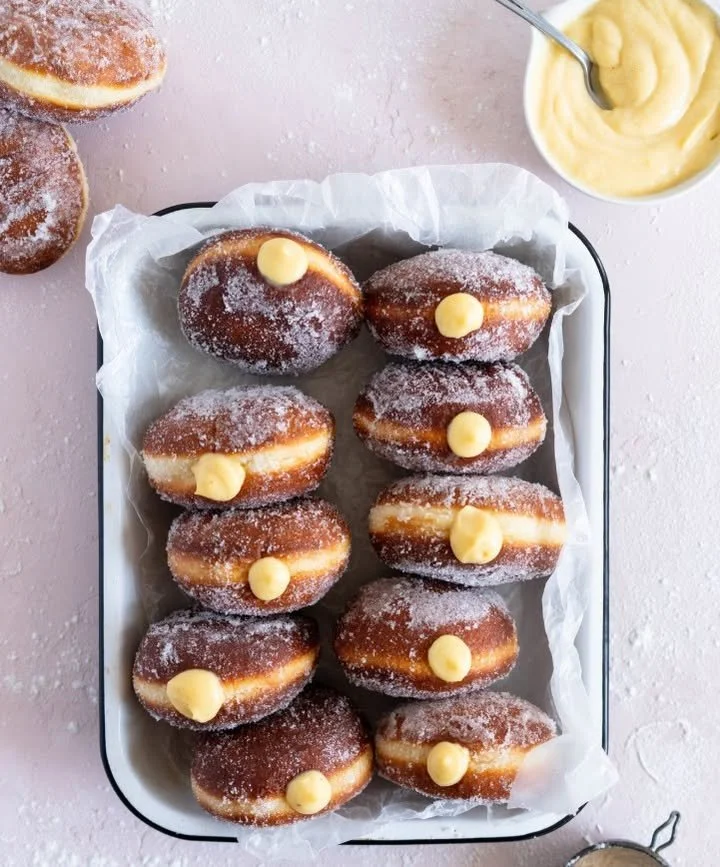 Delicious vanilla custard filled donuts on a plate