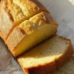 Delicious yogurt loaf cake sliced on a wooden board
